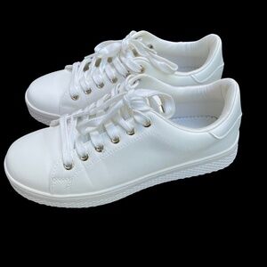 Call it Spring White Sneakers with gold tongue accent